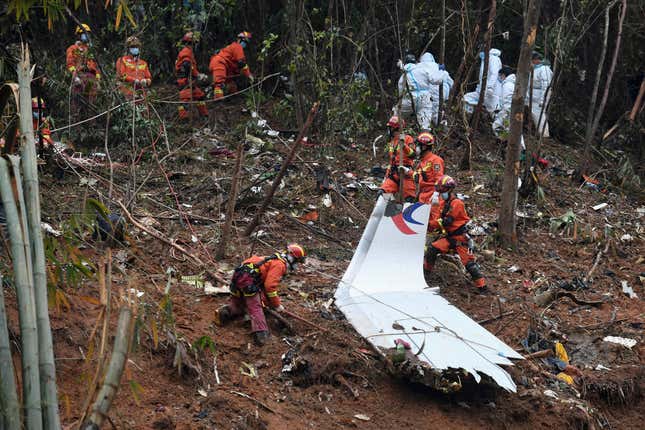 FILE - In this photo released by Xinhua News Agency, search and rescue workers search through debris at the China Eastern flight crash site in Tengxian County in southern China&#39;s Guangxi Zhuang Autonomous Region on March 24, 2022. Two years after a Boeing 737-800 passenger jet crashed on a domestic flight in China, killing all 132 people on board, accident investigators indicated Wednesday, March 20, 2024 that they have not yet determined the cause. (Lu Boan/Xinhua via AP, File)