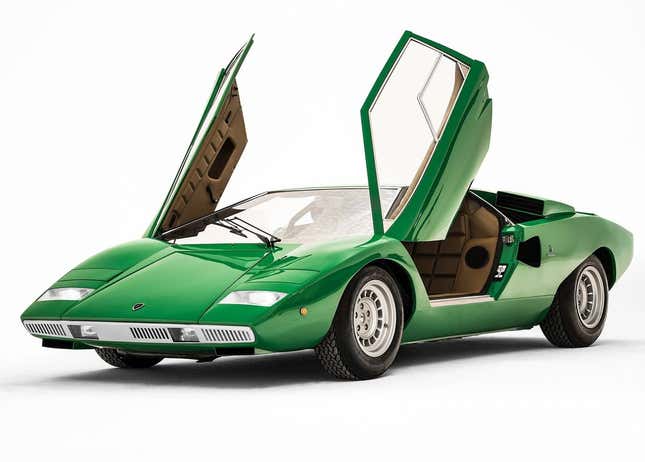 A early green Lamborghini Countach with both scissor doors open