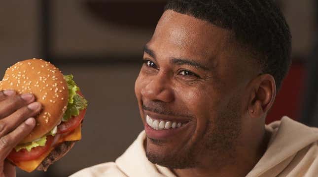 Rapper Nelly holds up Burger King burger