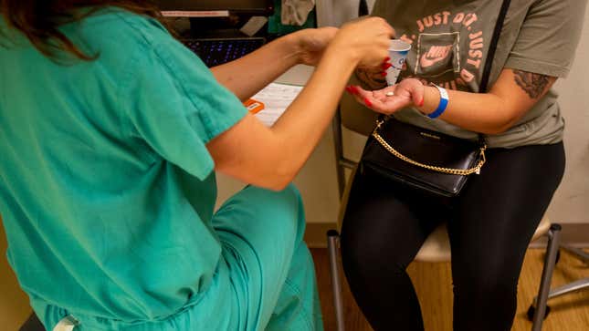 ALBUQUERQUE, NM — A resident gives a 25-year-old woman medication to terminate her pregnancy the day before the Supreme Court overturned Roe v. Wade at the Center for Reproductive Health clinic on June 23, 2022 in Albuquerque, New Mexico. The doctor does not want to be identified for security reasons.
