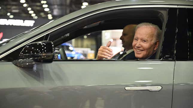 US President Joe Biden sits at the wheel of a Cadillac Lyriq electric vehicle as he visits the 2022 North American International Auto Show in Detroit, Michigan, on September 14, 2022.