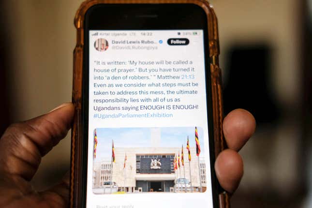 A view of a local scrolling on the X app formerly known as Twitter on a smartphone, in Kampala, Uganda Monday, March 4, 2024. An online protest campaign exposing corruption has rattled government officials and others in Uganda, where street protests are practically outlawed. The campaign, which relies on leaks of official documents, has been presented on the social media platform X as an “exhibition” — in a sequence of postings — about controversial issues, from failing hospitals to potholes in the streets of Kampala, the Ugandan capital. (AP Photo/Ajar Nalwadda)