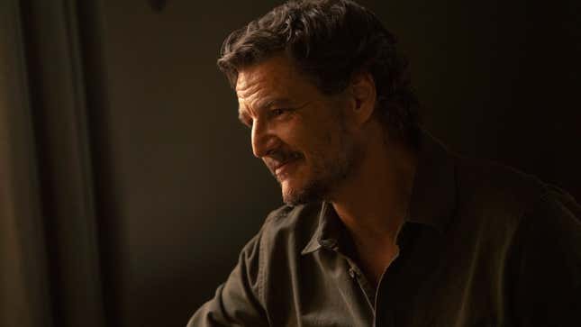 Joel smiles at something off-screen.