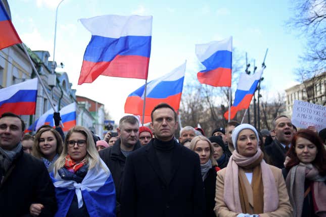 Russian opposition leader Alexey Navalny and other Russian demonstrators march in downtown Moscow