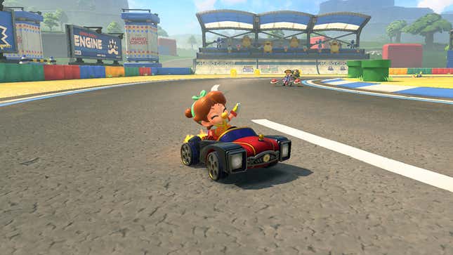 Baby Daisy drifts ahead on the Mario Circuit track.