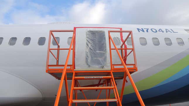 This photo released by the National Transportation Safety Board shows a gaping hole where the paneled-over door had been at the fuselage plug area of Alaska Airlines Flight 1282 on Sunday, Jan. 7, 2024, in Portland, Ore.