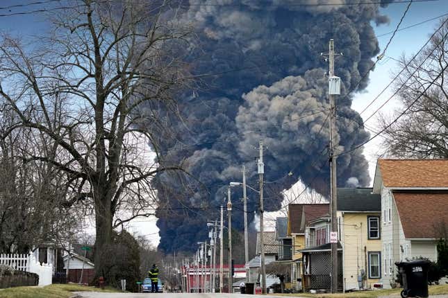 FILE - A black plume rises over East Palestine, Ohio, as a result of the controlled detonation of a portion of the derailed Norfolk Southern trains Monday, Feb. 6, 2023. The head of the National Transportation Safety Board told Congress Wednesday, March 6, 2024, that decision to blow open five tank cars and burn the toxic chemical inside them three days after a Norfolk Southern train derailed in Eastern Ohio last year wasn&#39;t justified. But NTSB Chair Jennifer Homendy said the key decision makers who feared those tank cars were going to explode never had all the information they needed. (AP Photo/Gene J. Puskar, File)