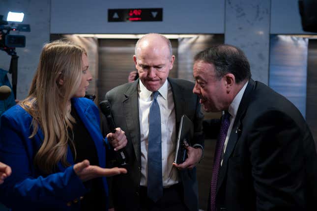 Boeing CEO Dave Calhoun, center, heads to an elevator after a meeting in the office of Sen. Mark Warner, D-Va., at the Capitol in Washington, Wednesday, Jan. 24, 2024. Part of the Boeing 737 MAX 9 fleet was grounded following a mid-air cabin panel blowout on an Alaska Airlines flight. (AP Photo/J. Scott Applewhite)