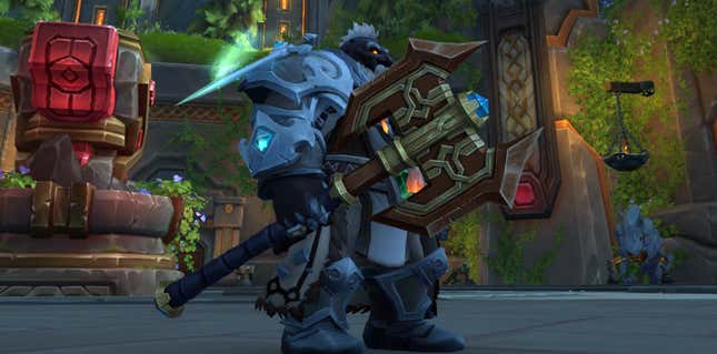 A dwarf holds a massive ax.