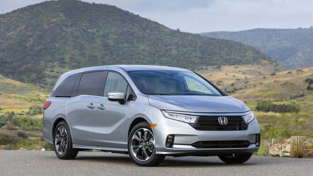 A photo of a silver Honda Odyssey minivan. 