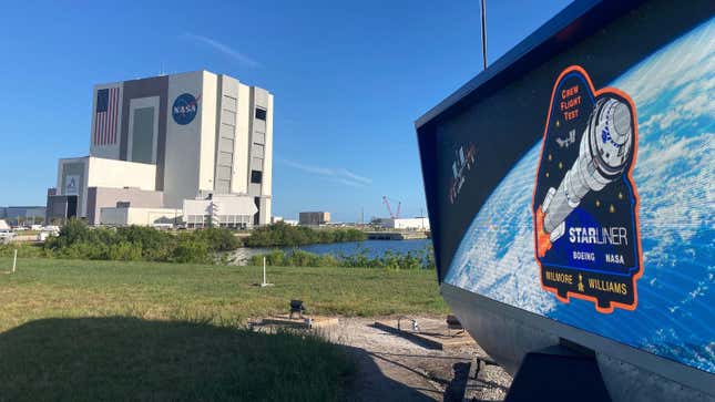 The countdown clock at Kennedy Space Center's press site sports the Boeing CST-100 Starliner logo for its Crew Test Flight mission awaiting launch from neighboring Cape Canaveral Space Force Station.