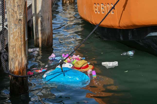 A view shows items from a Souvenirs stall that ended up in the Grand Canal in Venice due to strong winds, on August 18, 2022 as a result of bad weather. 