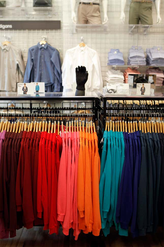 Multicolored sweat shirts hang inside of an American Apparel store in New York April 1, 2011. Clothing chain American Apparel, known for racy advertising and its founder's legal problems, may file for bankruptcy if it does not get enough money to keep running, and might even have to liquidate, the company said.