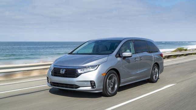 A silver Honda Minivan 