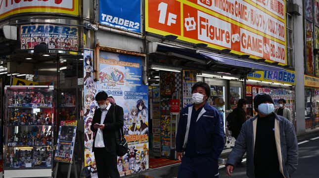 Pedestrians walking in Tokyo's famous Akihabara district, the epicenter of its retail anime and manga industry, in April 2020. In Japan, illegally downloading movies, music, manga, magazines, or academic publications can result in criminal penalties of up to two years in prison and a two million yen fine.