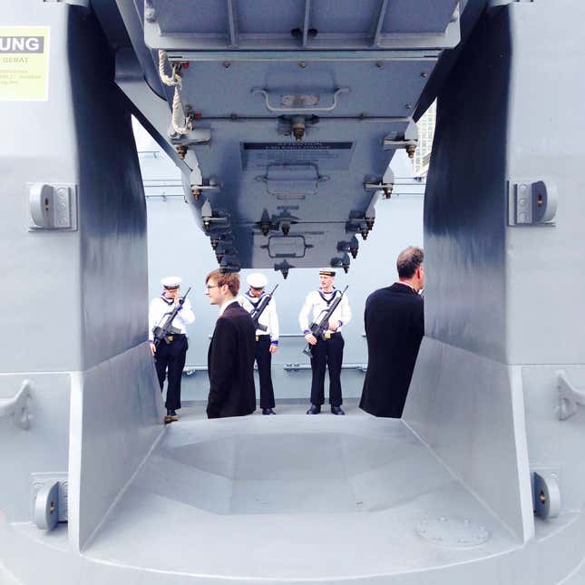 German sailors form a ceremonial guard for the ceremony aboard the Sachsen.