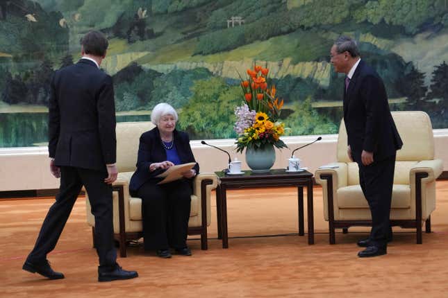 U.S. Treasury Secretary Janet Yellen, center, is seated before a meeting with Chinese Premier Li Qiang, right, at the Great Hall of the People in Beijing, China, Sunday, April 7, 2024. Yellen, who arrived later in Beijing after starting her five-day visit in one of China&#39;s major industrial and export hubs, said the talks would create a structure to hear each other&#39;s views and try to address American concerns about manufacturing overcapacity in China. (AP Photo/Tatan Syuflana, Pool)