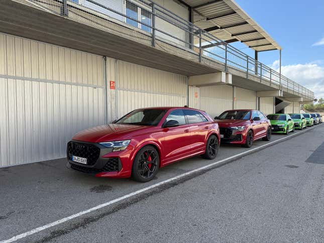 Front 3/4 view of two red 2025 Audi RS Q8 Performance