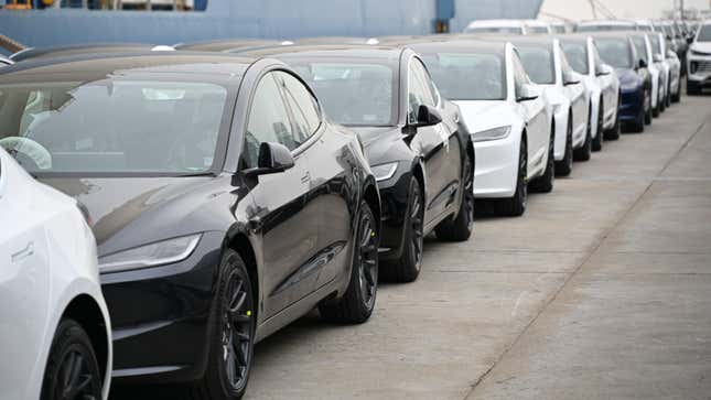 Tesla's new Model 3 sedans wait to be shipped aboard at Shanghai Haitong International Automotive Terminal on March 14, 2024 in Shanghai, China.