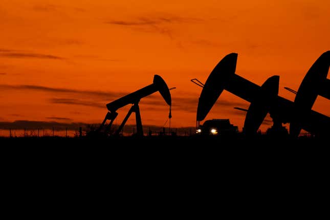 File - A truck passes oil pump jacks at dusk near Karnes City, Texas, Wednesday, Nov. 1, 2023. On Wednesday, the Commerce Department issues its second of three estimates of how the U.S. economy performed in the third quarter of 2023. (AP Photo/Eric Gay, File)