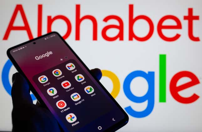 Google apps such as Gmail, Drive, Play Store, Maps, and Chrome are being displayed on a smartphone with Google Alphabet visible in the background.