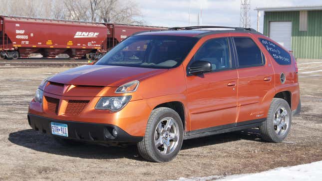 An orange 2005 Pontiac Aztec Rally