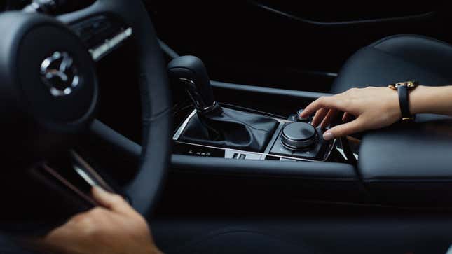 A photo of the interior dial on a Mazda3 car. 