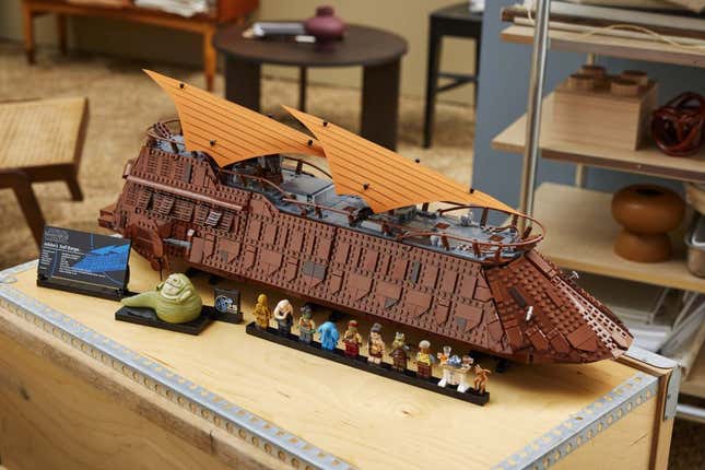 A guy plays with the Lego barge