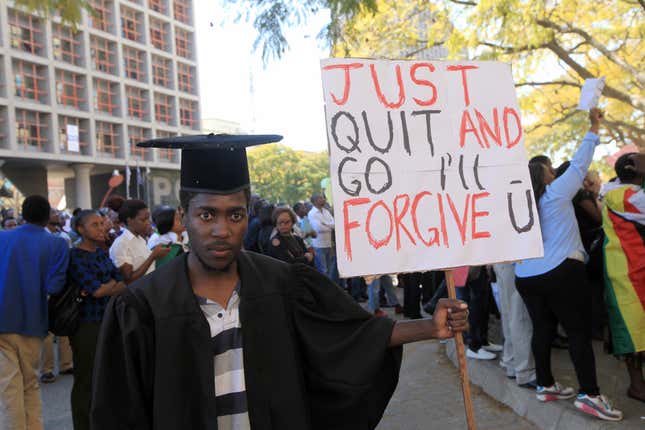 A jobless University graduate demonstrates outside of parliament in Harare.