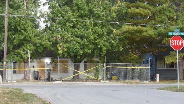 Police tape blocks off the Excelsior Springs residence of Timothy M. Haslett Jr., after the home was boarded up and fenced off Monday, Oct. 10, 2022, in Excelsior Springs, Mo., following a days-long execution of a search warrant at the home. Haslett was arrested Friday, Oct. 7, 2022, and is charged with first-degree rape or attempted rape, first-degree kidnapping and second-degree assault.