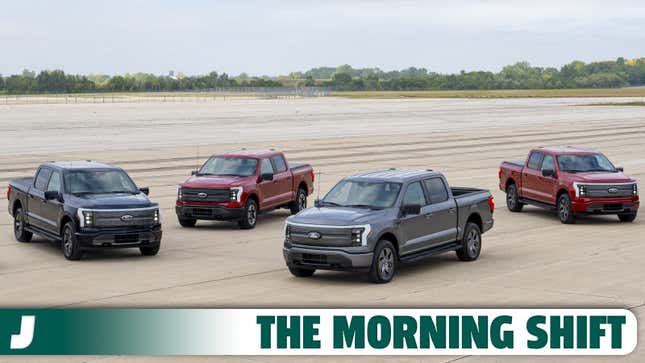 A photo of four Ford F-150 Lightning electric trucks. 