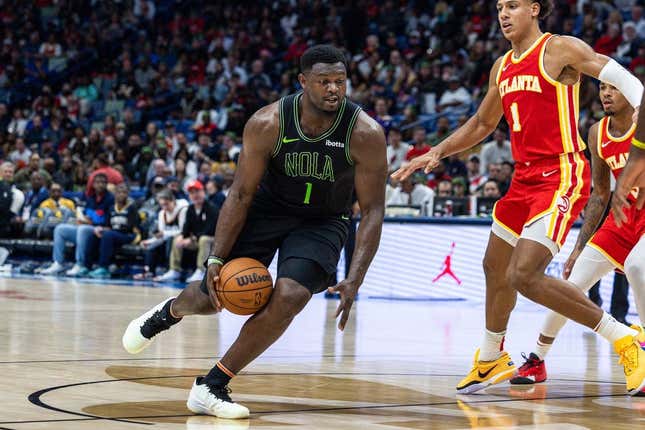 Nov 4, 2023; New Orleans, Louisiana, USA;  New Orleans Pelicans forward Zion Williamson (1) dribbles against Atlanta Hawks forward Jalen Johnson (1) during the second half at Smoothie King Center.