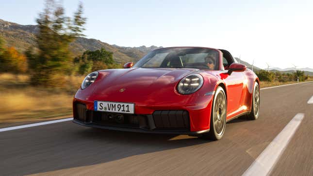 Front 3/4 view of a red 2025 Porsche 911 Carrera GTS