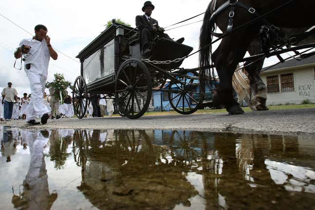 NEW ORLEANS - AUGUST 18: An empty casket honoring children killed by Hurricane Katrina is taken by horse-drawn carriage after a service at St. Paul’s Church of God in Christ in the Lower Ninth Ward August 18, 2007 in New Orleans, Louisiana. The second anniversary of Hurricane Katrina is August 29.