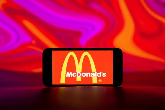 A McDonald’s logo on a mobile phone screen. 