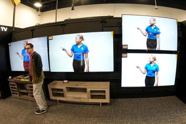 A customer turns away after looking at big-screen televisions on display in a Best Buy store Tuesday, Nov. 21, 2023, in southeast Denver. On Tuesday, the Conference Board reports on U.S. consumer confidence for November. (AP Photo/David Zalubowski)