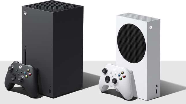 The Xbox Series X (left) and Series S (white) are stood up side-by-side, with the Series X truly towering over the Series S.