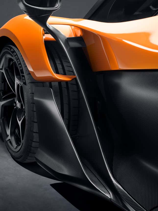 Front fender detail of an orange McLaren W1