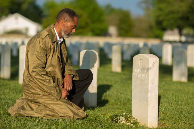 Stock image: Black man at cemetery