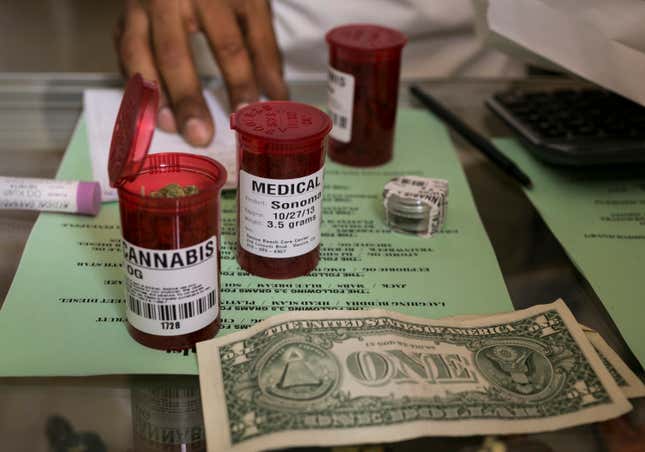 FILE - Medical marijuana prescription vials are filled at a medical marijuana dispensary in Venice, Calif., May 14, 2013. The U.S. Drug Enforcement Administration on Nov. 27, 2023, warned pharmacies in Georgia to not dispense medical marijuana products despite state permission to become the first pharmacies nationwide to do so. (AP Photo/Damian Dovarganes, File)