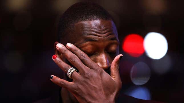 Former Miami Heat player Dwyane Wade reacts during a Hall of Fame induction ceremony during halftime between the Charlotte Hornets and Miami Heat at Kaseya Center on January 14, 2024 in Miami, Florida.