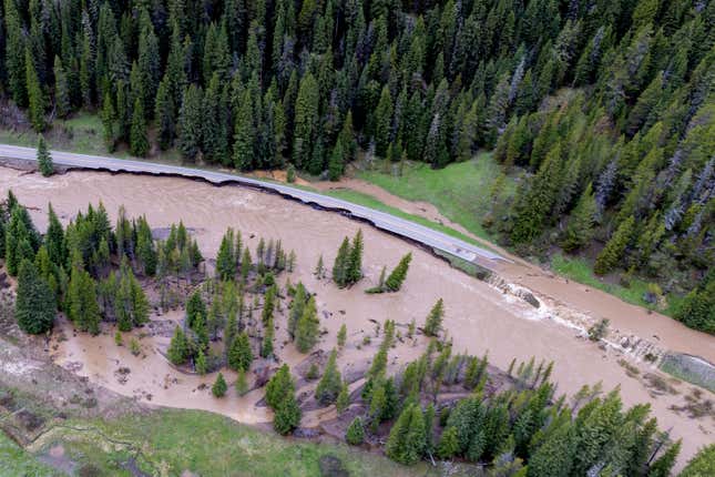 This aerial photo provided by the National Park Service shows a flooded  out North Entrance Road, of Yellowstone National Park in Gardiner,  Mont., on June 13, 2022.