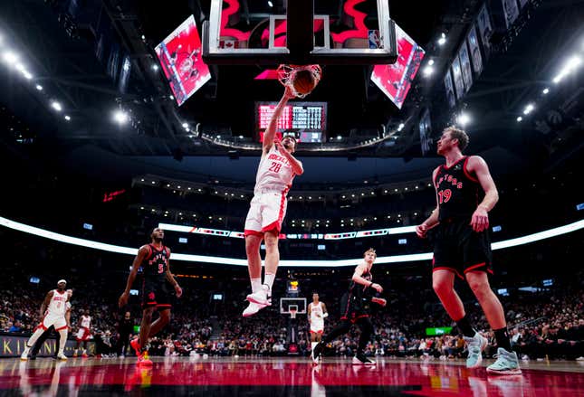 TORONTO, ON - FEBRUARY 9: Alperen Sengun #28 of the Houston Rockets goes to the basket against Jakob Poeltl #19 of the Toronto Raptors during the first half of their basketball game at the Scotiabank Arena on February 9, 2024 in Toronto, Ontario, Canada. NOTE TO USER: User expressly acknowledges and agrees that, by downloading and/or using this Photograph, user is consenting to the terms and conditions of the Getty Images License Agreement. (Photo by Mark Blinch/Getty Images)