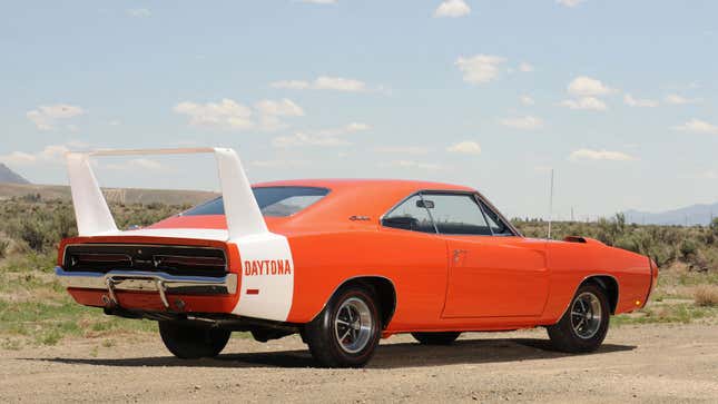 A photo of an orange Dodge Charger Daytona. 