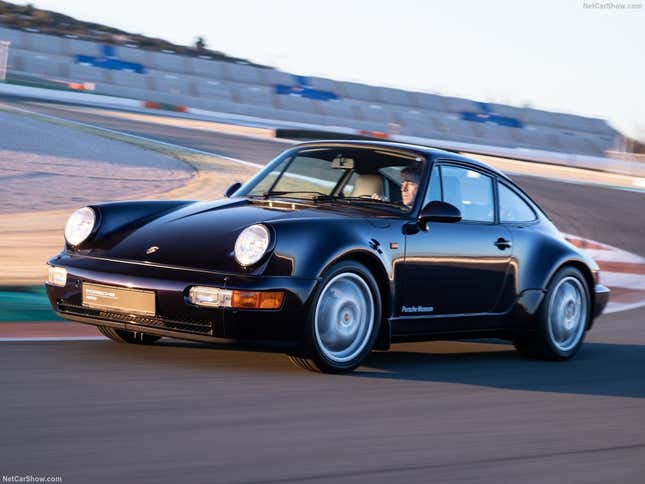 A 1994 Porsche Carrera 4 40 Jahres Edition drives on track.