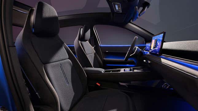 The interior of the ID. 2All concept car from Volkswagen including seats, two screens, and an array of buttons.