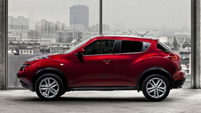 A profile photo of a red Nissan Juke SUV. 