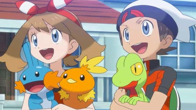 May and Brendan hold Mudkip, Torchic, and Treecko.