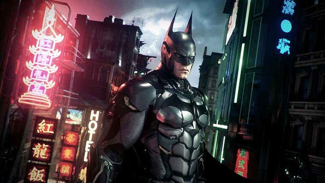 احصل على خصومات على ألعاب Batman Arkham والمزيد أثناء تخفيضات WB Steam 4 يقف باتمان على السطح وخلفه لافتات نيون