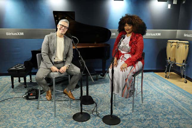 SiriusXM host Andy Cohen, left poses for a photo with Lizzo during a visit to SiriusXM’s Andy Cohen Live at the SiriusXM Studios on March 14, 2025 in New York City.